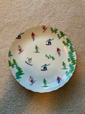 White Dinner Plate with Multicolor Skiers and Green Tree Border